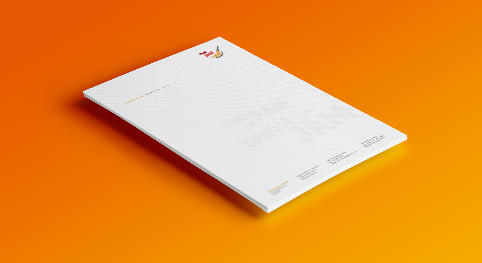Ansicht des Briefpapiers von PanJam auf Orangenem Untergrund